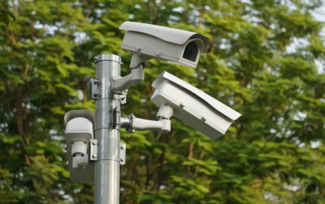 Many CCTV cameras monitoring a business, representing the need to balance security and privacy.