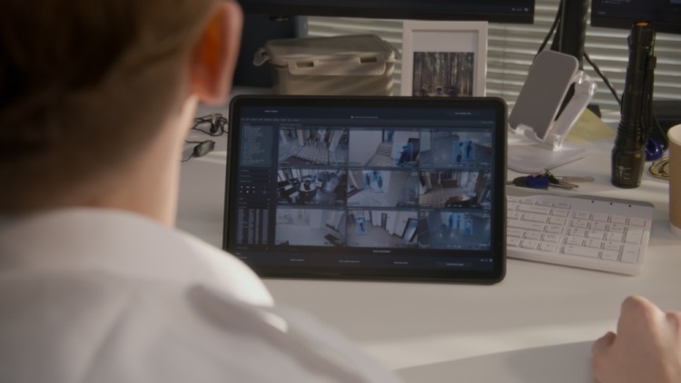 Man Monitoring Cctv Video For His Business