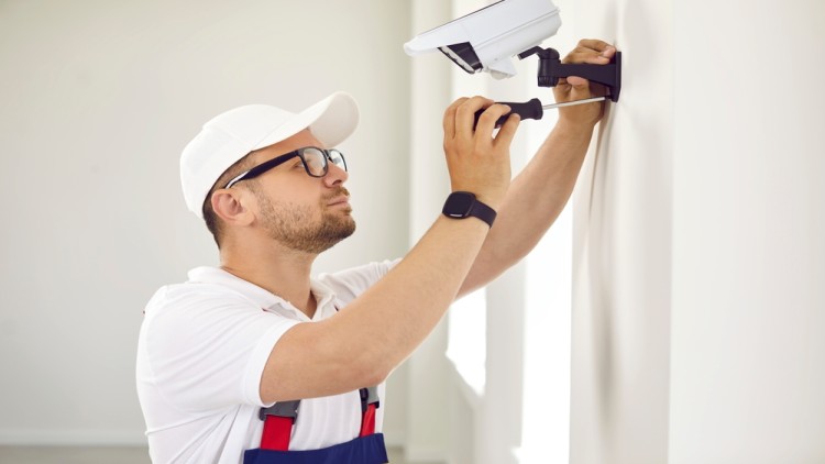 Technician Installing Cctv Camera